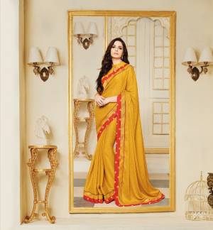 Celebrate Ths Festive Season Wearing This Saree In Yellow Color Paired With Yellow Colored Blouse. This Saree Is Fabricated On Silk Georgette Paired With Art Silk Fabricated Blouse. It Is Light Weight And Easy To Carry All Day Long.