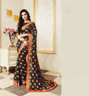 Enhance Your Personality Wearing This Saree In Navy Blue Color Paired With Navy Blue Colored Blouse, This Saree Is Fabricated On Silk Georgette Paired With Art Silk Fabricated Blouse. It Is Beautified With contrasting Floral Print All Over. 