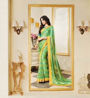 Cool Color Pallete Attire Always Looks Beautiful And Attractive, So Grab This Saree In Turquoise Blue And Yellow Color Paired With Turquoise Blue Colored Blouse, This Saree Is Fabricated On Silk Georgette Paired With Art Silk Fabricated Blouse. Buy This Saree Now.