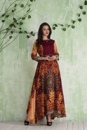 Grab This Attractive Patterned Floor Length Readymade Gown In Maroon And Multi Color Fabricated On Tussar Art Silk Beautified With Prints All Over. It Is Light Weight And Easy To Carry All Day Long.