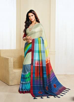 Look Beautiful Wearing This Saree In Off-White And Multi Color Paired With Orange Colored Blouse. This Saree And Blouse Are Fabricated On Jute Silk Beautified With Checks Prints, Buttons And Tassels.
