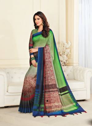 Attract All Wearing This Saree In Green And Multi Color Paired With Green And Colored Blouse. This Saree And Blouse Are Fabricated On Jute Silk Beautified With Prints And Pom-Poms. 