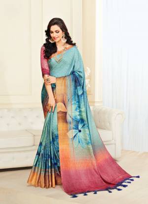 Here Is A Pretty Saree In Aqua Blue Color Paired With Contrasting Pink Colored Blouse. This Saree And Blouse Are Fabricated On Jute Silk Beautified With Bold Floral Print. Its Fabric Ensures Superb Comfort All Day Long. Buy Now.