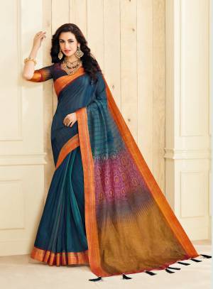 Enhance Your Personality Wearing This Satree In Dark Blue Color Paired With Dark Blue Colored Blouse. This Saree And Blouse Are Fabricated On Jute Silk Beautified With Prints, Buttons And Tassels.