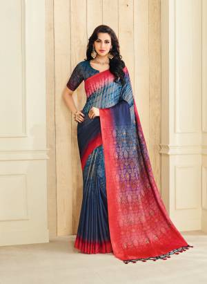 For Your Semi-Casual Or Festive Wear, Grab This Saree In Blue And Red Color Paired With Blue Colored Blouse. This Saree And Blouse Are Fabricated On Jute Silk Beautified With Prints, Buttons And Tassels. Buy This Saree Now.