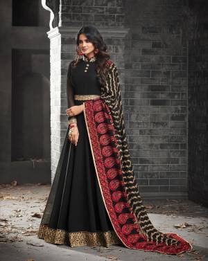 For A Bold And Beautiful Look, Grab This Designer Floor Length Suit Black Color Paired With Black Colored Bottom And Dupatta. Its Top Is Fabricated On Georgette Paired With Santoon Bottom And Georgette Dupatta. It Has Heavy Embroidery All Over The Dupatta Which Is Making The Suit Attractive And Giving A Heavy Look.