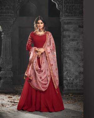 Adorn The Pretty Angelic Look Wearing This Designer Floor Length Suit In Red Colored Top Paired With Red Colored Bottom And Contrasting Baby Pink Colored Dupatta. Its Top Is Fabricated On Georgette Paired With Santoon Bottom And Net Fabricated Dupatta. Its Pretty Color Pallete And Heavy Embroidery Will Earn You Lots Of Compliments From Onlookers.