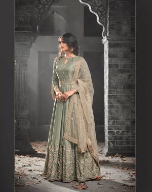 Here Is A New And Unique Shade In Designer Floor Length Suit In Very Pretty Light Mint Green Colored Top Paired With Light Green Colored Bottom And Light Beige Colored Dupatta. Its Top Is Fabricated On Satin Silk Paired With Santoon Bottom And Net Dupatta. Its Fabrics Are Soft Towards Skin And Ensures Superb Comfort Throughout The Gala.