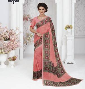 Here Is A Very Pretty Peach Colored Saree Paired With Peach Colored Blouse. This Saree And Blouse Are Fabricated On Georgette Beautified With Prints Over The Border. Buy This Saree Now.
