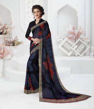 For A Bold And Beautiful Look, Grab This Dark Saree In Black And Dark Blue Color Paired With Black Colored Blouse. This Saree And Blouse Are Fabricated On Georgette Beautified With Prints. 