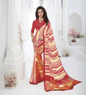Add Some Casuals With This Pretty Simple Saree In Cream And Red Color Paired With Red Colored Blouse. This Saree And Blouse Are Fabricated On Georgette Beautified With Prints All Over.