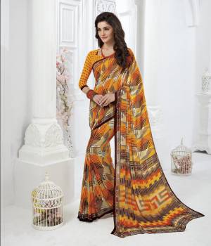 Yellow Attracts Everyones Attention, Grabt This Pretty Saree In Yellow Color Paired With Yellow Colored Blouse. This Saree And Blouse Are Fabricated On Georgette Beautified With Prints All Over. Its Fabrics Ensures Superb Comfort All Day Long.