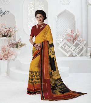 Grab This Pretty Attractive Saree In Yellow Color Paired With Contrasting Red Colored Blouse. This Saree And Blouse Are Fabricated On Georgette Beautified With Prints All Over The Saree.