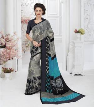 For An Elegant Look, Grab This Saree In Grey Color Paired With Black Colored Blouse. This Saree And Blouse Are Fabricated On Georgette Beautified With Multiple Prints. 