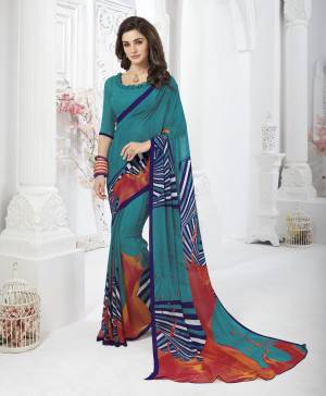 Pretty Shade In Blue Is Here With This Saree In Teal Blue Color Paired With Teal Blue Colored Blouse. This Saree And Blouse Are Fabricated On Georgette. This Fabric Is Soft Towards Skin And Easy To Carry All Day Long.