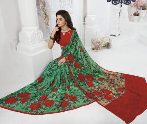 For A Proper Traditional Look, Grab This Saree With Traditional Combination With This Saree In Green Color Paired With Contrasting Red Colored Blouse. This Saree And Blouse Are Fabricated On Georgette Beautified With Floral Prints.