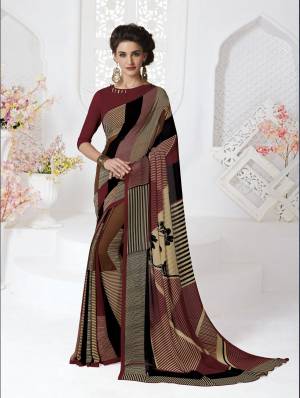 Go Colorful With This Saree In Multi Color Paired With Maroon Colored Blouse. This Saree And Blouse Are Fabricated On Georgette Beautified With prints. It Is Light In Weight And Easy To Carry All Day Long.