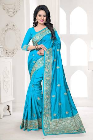 Lovely Shade In Blue Is Here With This Saree In Turquoise Blue Color Paired With Turquoise Blue Colored Blouse. This Saree And Blouse Are Fabricated On Art Silk Beautified With Jari Embroidery. Buy This Saree Now.