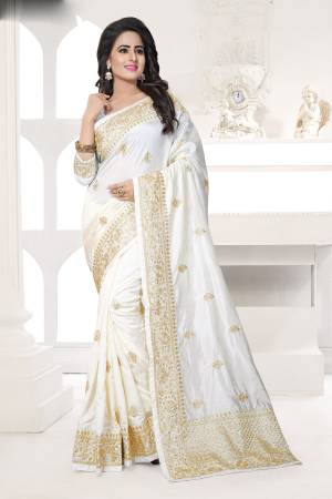 Flaunt Your Rich And Elegant Taste Wearing This Saree In White Color Paired With White Colored Blouse. This Saree And Blouse Are Fabricated On Art Silk Beautified With Jari Embroidery. Buy This Saree Now.