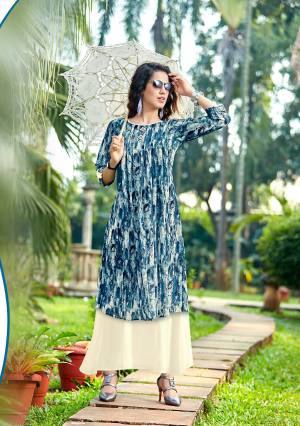 Here Is A Double Layered Designer Readymade Kurti In Blue And Off-White Color Fabricated On Georgette. This Kurti Is Light Weight And Easy To Carry All Day Long. Buy Now.