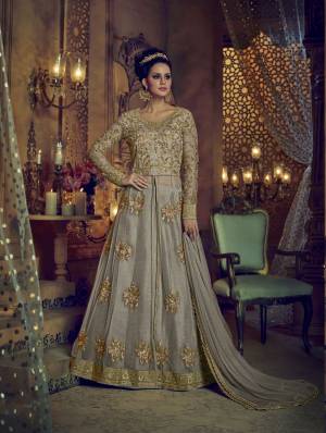 Rich And Elegant Looking Designer Floor Length Suit Is Here In Grey Colored Top Paired With Grey Colored Lehenga, Pants And Dupatta. Its Top Is Fabricated On Net Paired With Art Silk Fabricated Lehenga And Pants With Net Fabricated Dupatta. It Has Lovely Contrasting Embroidery Over The Top And Pants.