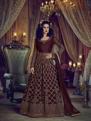 You Will Definitely Earn Lots of Compliments With This Royal Looking Designer Floor Length Suit In Maroon Colored Top Paired With Maroon Colored Pants, Lehenga And Dupatta. Its Top IS Fabricated On Net Paired With Art Silk Fabricated Lehenga And Pants And Net Fabricated Dupatta. This Heavy And Rich Looking Suit Is Beautified With Heavy Embroidery .