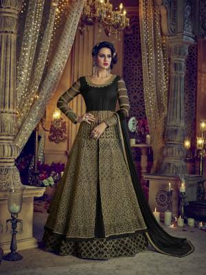 For A Bold And Beautiful Look, Grab This Designer Indo-Western Suit In Black Color. Its Top And Dupatta Are Fabricated Net Paired With Art Silk Fabricated Lehenga And Pants. It Is Beautified With Heavy Embroidery Over Its Top And Pants. 