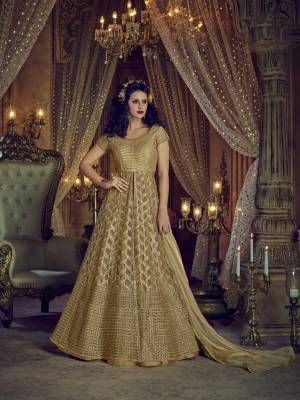 Simple And Elegant Looking Designer Indo-Western Suit Is Here In Beige Color Paired With Beige Colored Lehenga , Apnts And Dupatta. Its Top And Dupatta Are Fabricated On Net Paired With Art Silk Fabricated Lehenga And Pants. All Its Fabrics Ensures Superb Comfort All Day Long. 
