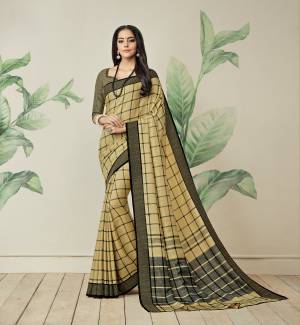 Most Trending Print In Every Attire IS Here With This Saree In Light Yellow Color Paired With Light Yellow Colored Blouse. This Saree Is Fabricated On Jute Art Silk Paired With Art Silk Fabricated Blouse. This Saree Is Beautified With Checks Prints All Over It.
