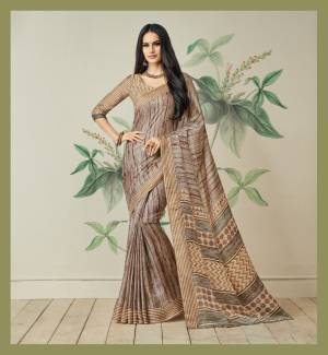 Simple Adnd Elegant Looking Saree Is Here In Beige Color Paired With Beige Colored Blouse. This Saree Is Fabricated On Jute Art Silk Paired With Art Silk Fabricated Blouse. It Has Pretty Sinple Prints All Over It. 