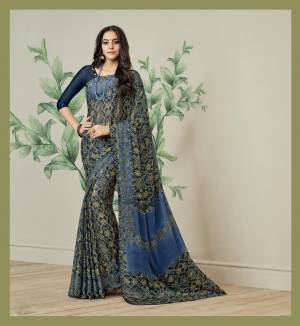 Enhance Your Personality Wearing This Printed Saree In Navy Blue Color Paired With Navy Blue Colored Blouse. This Saree Is Fabricated On Jute Art Silk Paired With Art Silk Fabricated Blouse. It Has contrasting Prints All Over The Saree.