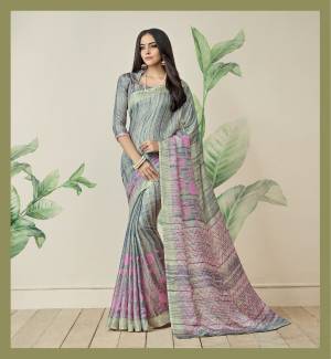 Rich And Elegant Looking Saree Is Here In Grey Color Paired With Grey Colored Blouse. This Saree Is Fabricated On Jute Art Silk Paired With Art Silk Fabricated Blouse. It Has Pretty Simple Prints All Over The Saree In Grey And Contrasting Pink Color.