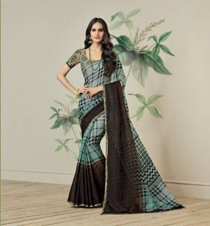 Another Checks Printed Saree Is Here In Baby Blue And Brown Color Paired With Beige Colored Blouse. This Saree Is Fbricated On Jute Art Silk Paired With Art Silk Fabricated Blouse. Buy This Saree Now.