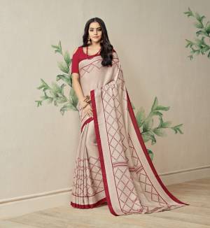 Flaunt Your Rich And elegant Taste Wearing This Sree In Cream Color Paired With Red Colored Blouse. This Saree Is Fabricated On Jute Art Silk Paired With Art Silk Fabricated Blouse. It Has Very Simple And Least Prints Over The Saree.