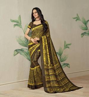 Lovely Color Pallete Has Been Used For This Saree, Grab This Saree In Brown And Yellow Color Paired With Brown Colored Blouse. This Saree Is Fabricated On Jute Art Silk paired With art Silk Fabricated Blouse. 