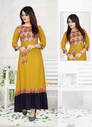 Here Is A Kurti Suitable For Your Semi-Casual Wear In Musturd Yellow Color. This Pretty Kurti Is Fabricated On Rayon Beautified With Prints And Thread Work. Buy This Readymade kurti Now.