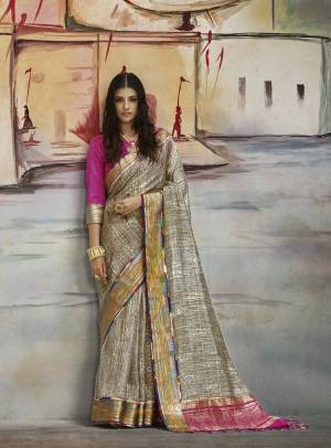 Flaunt Your Rich And elegant Taste Wearing This Silk Saree In Grey Color Paired With Contrasting Dark Pink Colored Blouse. This Saree Is Fabricated On Nylon Art Silk Paired With Brocade Fabricated Blouse. It Has Simple Prints And Lace Border. Buy Now.