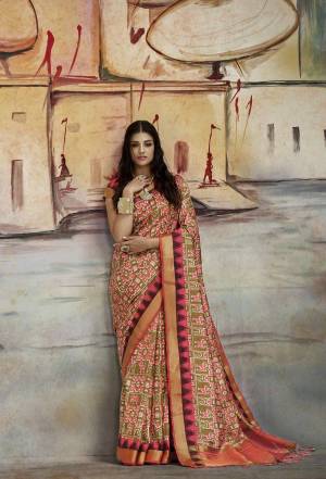 Add This Lovely Shade To Your Wardrobe With This Saree In Olive Green Color Paired With Contrastinf Red Colored Blouse. This Saree Is Fabricated On Nylon Art Silk Paired With Brocade Fabricated Blouse.  Grab This Lovely Saree Now.