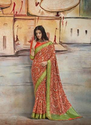 New And Unique Shade Is Here With This Saree In Rust Orange Color Paired With Orange Colored Blouse.  This Saree Is Fabricated On Nylon Art Silk Paired With Brocade Fabricated Blouse. It Has Pretty Prints All Over The Saree.