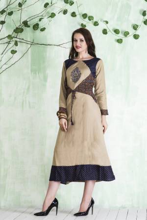 Simple Kurti Is Here for Your Semi-Casual Wear In Cream Color. This Readymade Kurti Is Fabricated On Cotton Beautified With Prints. It Is Light Weight And Easy To Carry All Day Long.