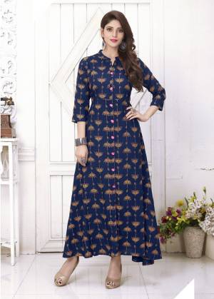 Enhance Your Personality Wearing This Designer Readymade Kurti In Dark Blue Color Fabricated On Cotton Beautified With Umbrella Prints All Over The Kurti. This Kurti Is Light Weight And Its Fabrics Ensures Superb Comfort All Day Long. Buy Now.