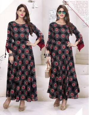 Here Is A Bell Sleeves Designer Readymade Kurti In Black Color. This Pretty Kurti Is Fabricated On Cotton Beautified With Prints All Over It. It Is Light Weight And Easy To Carry All Day Long.