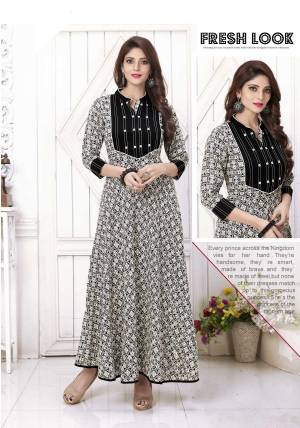 For Your Semi-Casual Wear, Grab This Pretty Kurti In Black And White Color Fabricated On Cotton Beautified With Prints All Over It. This Readymade Kurti Is Light Weight And Easy To Carry All Day Long. Buy Now.