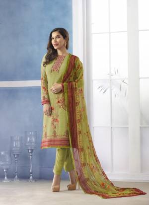 Grab This Pretty Designer Semi-Stitched Suit In Light Green Color Paired With Light Green Colored Bottom And Dupatta. Its Top Is Fabricated On Georgette Paired With Santoon Bottom And Chiffon Dupatta. It Is Beautified With Prints And Embroidery Which Is Making The Suit Attractive.