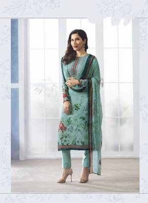 Here Is A Lovely Shade In Blue With This Semi-Stitched Suit In Aqua Blue Color Paired With Aqua Blue Colored Bottom And Dupatta. Its Top Is Fabricated On Georgette Paired With Santoon Bottom And Chiffon Dupatta. It Is Light In Weight And Easy To Carry All Day Long.