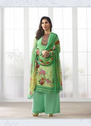 For Your  Semi-Casual Wear, Grab This Pretty Semi-Stitched Suit Is Here In Green Color Paired With Green Colored Bottom And Dupatta. Its Top Is Fabricated On Georgette Paired With Santoon Bottom And Chiffon Dupatta. Its Fabric Enusres Superb Comfort All Day Long. Buy This Suit Now.
