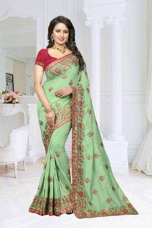 Add This New And Unique Shade To Your Wardrobe In Saree With This Very Pretty Mint Green Colored Saree Paired With Contrasting Dark Pink Colored Blouse. This Saree Is Fabricated On Soft Silk Paired With Art Silk Fabricated Blouse. It Has Attractive Contrasting Embroidery All Over The Saree.
