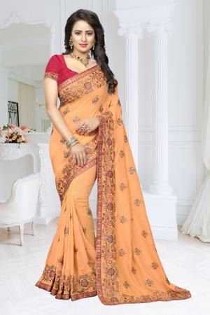 Bring Out The New Shades In Orange With This Designer Saree In Light Orange Color Paired With Contrasting Dark Pink Colored Blouse. This Saree Is Fabricated On Soft Silk Paired With Art Silk Fabricated Blouse, Buy This Heavy Designer Saree Now.