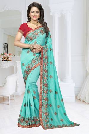 Lovely Shade In Blue Is Here With This Designer Saree In Aqua Blue Color Paired With Contrasting Dark Pink Colored Blouse. This Saree Is Fabricated On Soft Silk Paired With Art Silk Fabricated Blouse. Buy This Designer Saree Now.