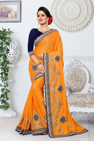 Celebrate This Festive Wearing This Beautiful Designer Saree In Musturd Yellow Color Paired With Contrasting Navy Blue Colored Blouse. This Saree Is Fabricated On Silk Paired With Art Silk Fabricated Blouse. It Is Easy To Drape And Carry All Day Long.